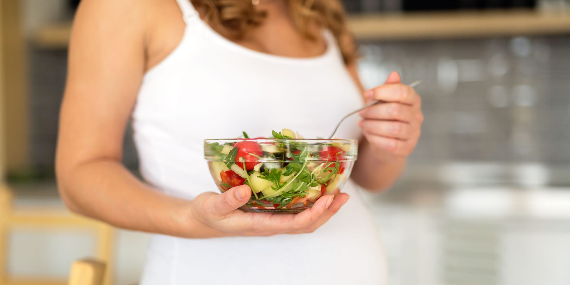 pregnant-woman-eating-healthy-food-F6CGB38